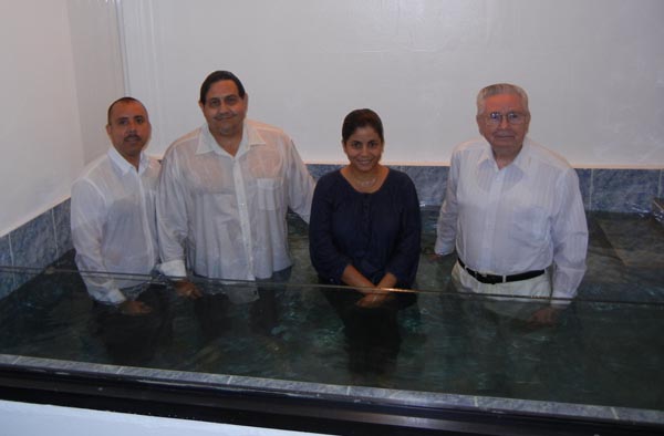 César and Nancy Torres, in the middle, were baptized in Bayamón, Puerto Rico, May 28, 2014, by Dewayne Shappley (right) and Jorge Ginés López (left).