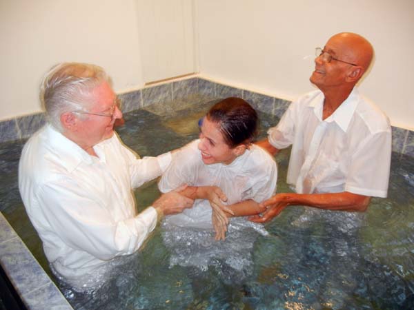 Ada Marie rejoices after her baptism by Dewayne Shappley and José Álamo in the Bayamon, Puerto Rico church of Christ, November 29, 2015.