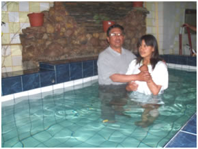 A lady is baptized in El Alto, Bolivia as a result of evangelism carried out by members of the church of Christ.