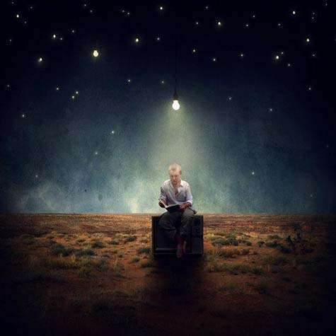 This image of a man who is reading by the white light of a bulb suspended in space in the midst of darkness all around him illustrates the sermon-study: Children of light, let us keep the darkness at bay!